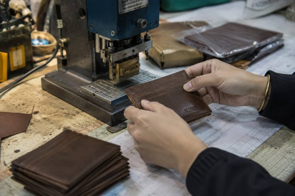 Leather wallet logo application and final quality inspection