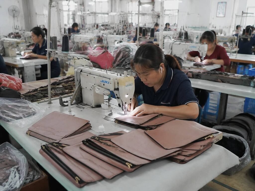 How Custom Makeup Bags Are Made: From Design Concept to Mass Production 4 makeup bag production line sewing workshop factory workers