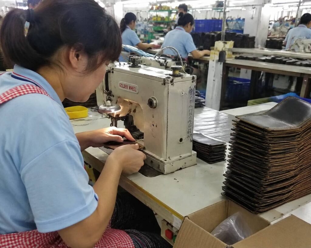 How Leather Wallets Are Made: A Complete Manufacturing Process 4 Leather wallet stitching and assembly in factory workshop