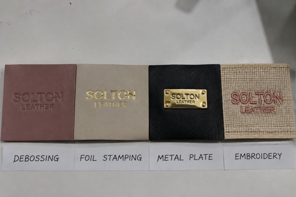 custom cosmetic bag logo methods debossing silkscreen foil stamping metal plate embroidery
