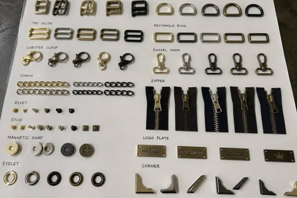 YKK zippers, custom buckles, D-rings, and logo-engraved hardware in various finishes